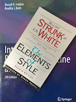 The Elements of Style, by Strunk and White, superimposed on Intermediate Physics for Medicine and Biology.