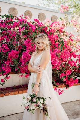 bride smiling with flowers