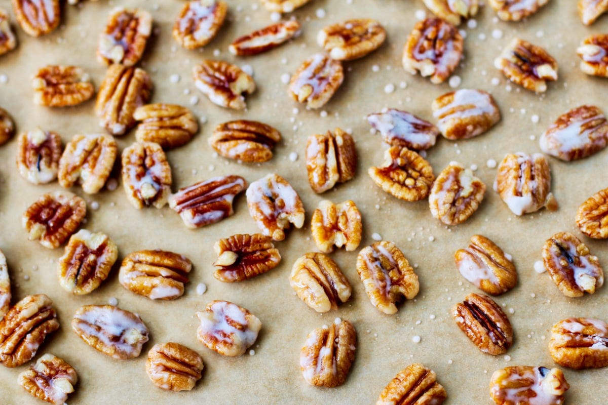 Pecan halves after tossing with sugar.