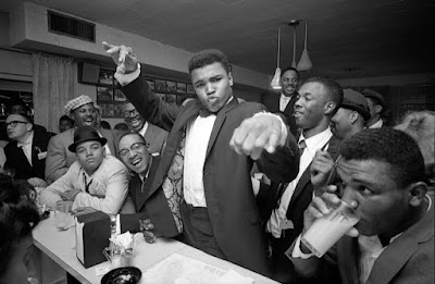 Muhammad Ali's fist towards camera at his victory party after he defeated Sonny Liston, February, 1964, Miami