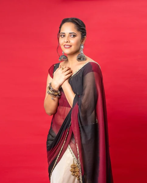 Anasuya Bharadwaj pretty in transparent half saree