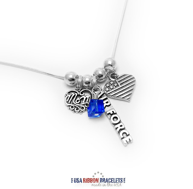 Air Force Mom Necklace with a Filigree Mom Charm, Heart Flag Charm, Air Force charm and a Birthstone Crystal charm.