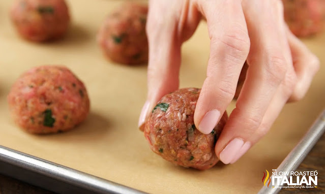 italian meatballs on baking sheet, before baking