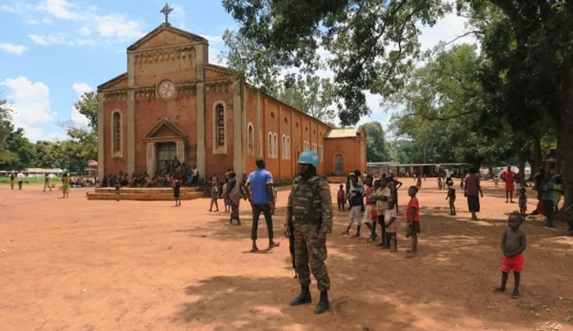 Cover Image Attribute: The file photo of UNMISS peacekeepers from Ethiopia guarding church premises in Tambura where internally displaced persons are seeking protection from ongoing violence. / Date: September 2021, Source: Felix Katie/UNMISS