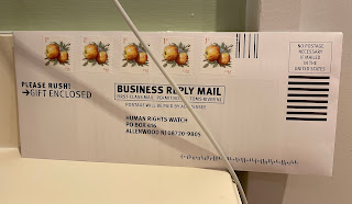 PICTURE OF AN ENVELOPE WITH SOME 1-CENT STAMPS