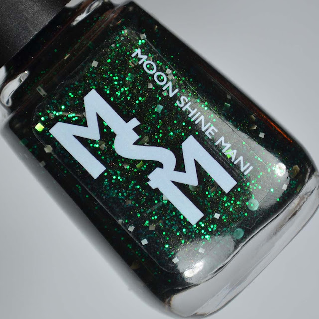 black jelly nail polish with green glitter in a bottle