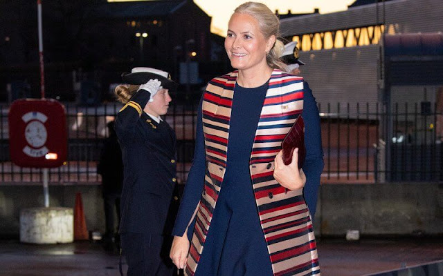 Crown Princess Mette Marit wore a satin stripe sleeveless trench coat by Tome. Queen Maxima wore a navy and beige dress by Jan Taminiau