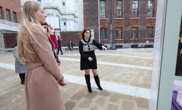 Princess Eugenie wore a black pleated dress with tweed cardigan short jacket from Oscar De La Renta, and black, knee-high boots