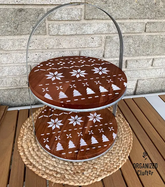 Photo of a Target Joanna Gaines Hearth & Hand Tiered Stand stenciled with a Poinsettia Christmas Sweater Stencil from Old Sign Stencils.