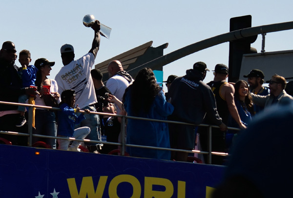 Leonard Floyd continues to show off the Lombardi Trophy as his bus drives down South Figueroa Street...on February 16, 2022.