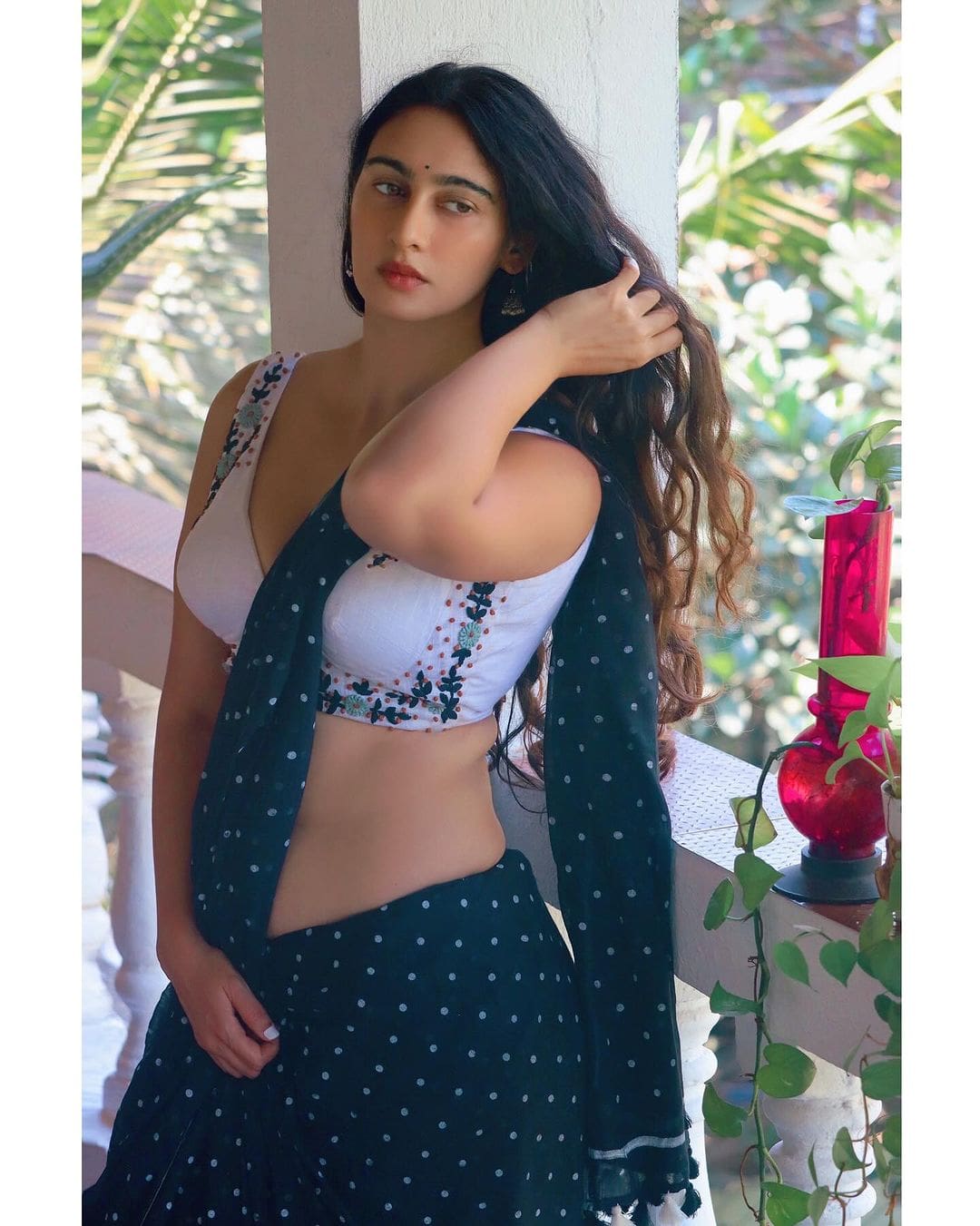 Megha Shukla sizzles on Instagram in a White Backless Blouse with a Plunging Neckline and Green Saree