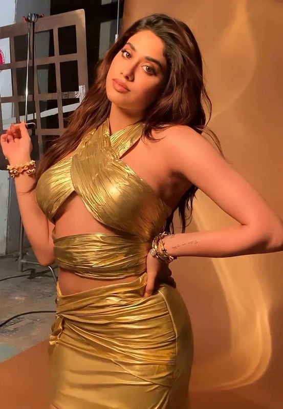 Janhvi Kapoor looks sexy in a short gold, cut-out dress