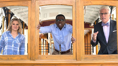 Eleanor, Chidi, and Michael (three main characters from The Good Place) look out a trolley during the simulation of "the trolley problem"