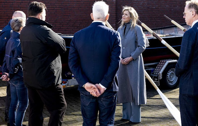 Dutch Queen Maxima wore a twill belted jacket by Natan, and wool casmere merino coat from Natan