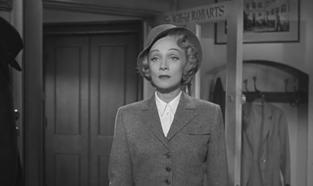 Marlene Dietrich in grey suit and hat