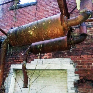 " ductwork out side derelict  mill"