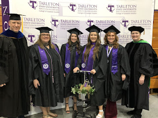 6 people in graduation regalia