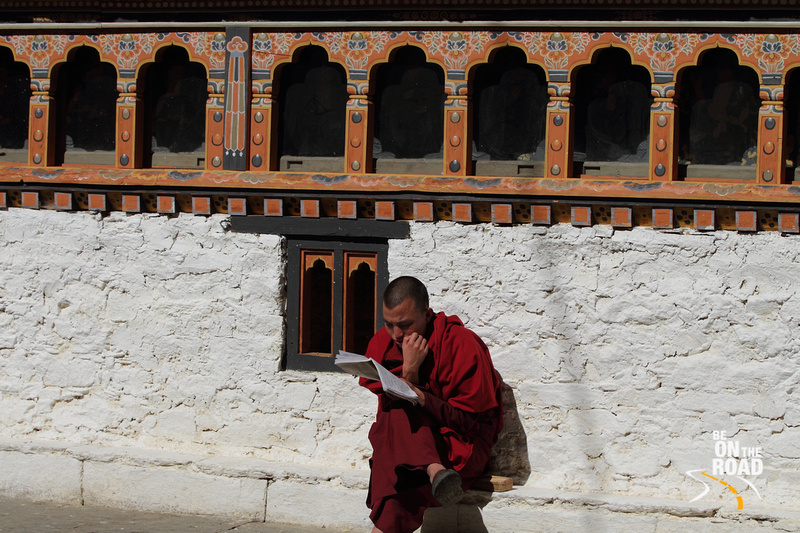 Monk studies inside Simtokha Dzong, Bhutan