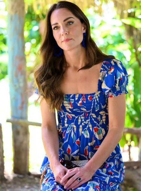 Kate Middleton wore a blue floral print midi dress by Tory Burch, and Sezane Charlie earrings. Che'il chocolate farm