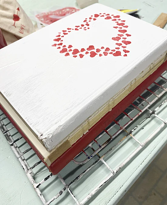 heart stencil on book stack