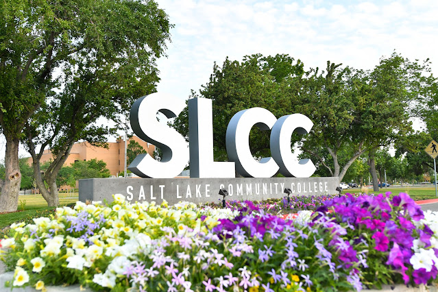 Outdoor Salt Lake Community College sign surrounded by flowers.