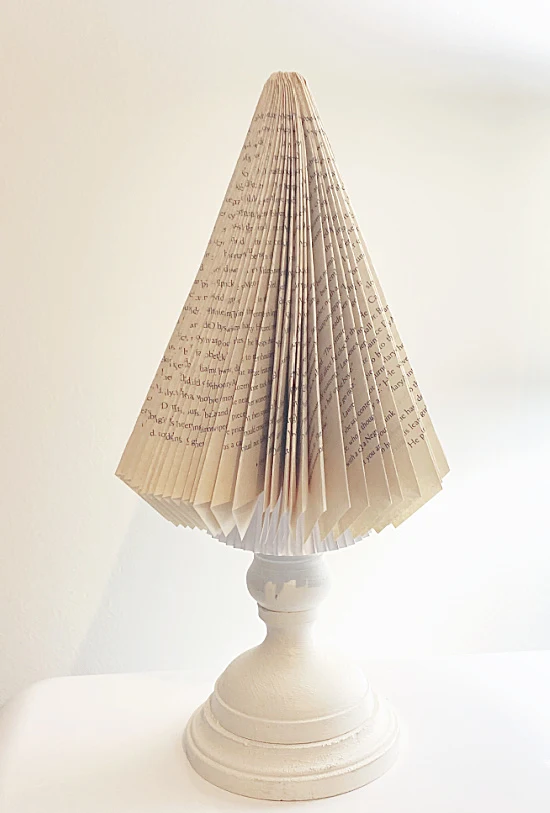 folded book cone on a candlestick