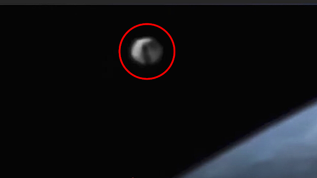 A close up of the UFO sighting at the ISS with the black window scanning the station.