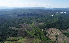 Located in northeastern China the discovery of the largest impact crater on Earth  Part of the southern edge of Yilan Crater is missing, so the geological structure looks like a crescent from above. When the Earth, Moon, or other planets are subjected to an "impact event" by meteorites, asteroids, or a large celestial body; This leads to the resulting craters, which are called "impact craters".  One of the most famous collision events is the asteroid impact that led to the "Chicxulub crater" near the town of Chicxulub in the Yucatan Peninsula, Mexico, which occurred about 66 million years ago in the prehistoric period, and led to the extinction of dinosaurs and other creatures on Earth.  But recently, according to a report published by Live Science, the largest impact crater on Earth was discovered, in the Lesser Xingan mountain range, northeastern China, which is in the form of a crescent, and was formed in the past 100,000 years. This crater is called "Yilan crater", after the village near it.  Yilan nozzle According to the statement issued by the NASA Earth Observatory, the Yilan crater is the second to be discovered in China after the relatively small "Xiuyan crater" that was discovered in the coastal province of Liaoning before 2020. 190 craters are known around the world, according to a report by Forbes magazine.  The scientific team published a study in the journal Meteoritics and Planetary Science. According to a NASA statement, the discovery of this crater dates back to 2019, and in July 2021, after studying the latest satellite images of the site; The team became more convinced that it was an impact crater.  Based on the analysis of satellite images, the scientists confirmed that a geological structure in the Lesser Xingan Mountains was formed as a result of the collision of a space rock or an asteroid with Earth. As a result of this collision, a crater with a diameter of about 1.85 km was formed.  It likely formed about 46,000 to 53,000 years ago, based on radiocarbon dating of coal deposits and organic lakes from the site. To study the geological structure of this crater; The researchers collected sediment samples from the center of the crater in order to analyze them and reveal their characteristics.  Sediment samples analysis According to the Live Science report, the hole filling consists of a successive series of sediments 100 meters thick, and beneath it a layer of broken granite 320 meters thick, which is a granite consisting of many rock fragments fastened together in a matrix. This rock bears scars indicating the impact of the meteorite that hit it.  For example, the rock fragments show signs of melting and recrystallization during the impact, as the granite rapidly heats to more than 1,200 degrees, then cools in situ, consistent with the impact.  Lithographic analyzes of the undissolved granite blocks show the presence of shock minerals such as quartz crystals with a distinctive pattern of parallel, planar cracks, as a result of shock waves that travel through the bedrock.  On the other hand, the results of the analysis showed teardrop-shaped glass fragments, and pieces of glass pierced with small holes resulting from gas bubbles, and these two features also indicate a high-intensity collision there.  Why does the crater look like a crescent? According to the Global Times, part of the southern edge of the Yilan crater is missing, so the geological structure looks like a crescent from above .  Chen Ming, one of the article's authors and a research fellow from the Guangzhou Institute of Geochemistry, told the newspaper that such crescent-shaped craters are relatively rare on Earth.  The Live Science report adds that in October 2021, the "Landsat 8" satellite captured stunning shots of the northern edge of the crater, which showed the shape of the crescent.  According to a NASA statement, scientists are investigating how and when the southern edge lost its parts, which led to the appearance of this shape.