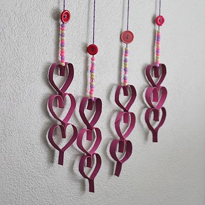 Cardboard Tube Dangling Hearts