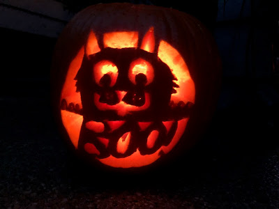 cat-themed carved pumpkin