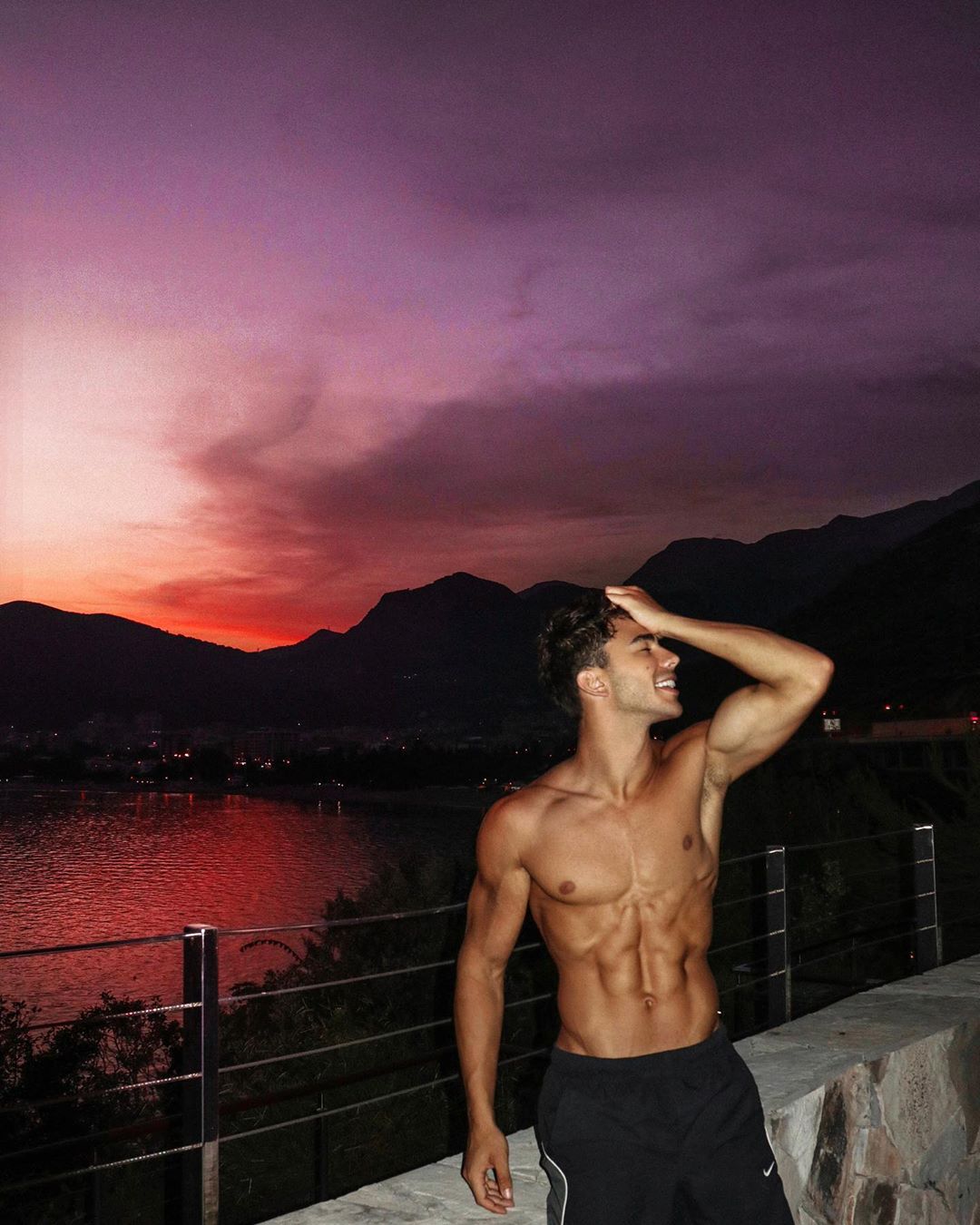 hot-shirtless-guy-abs-stefan-stojanov-smile-purple-sunset