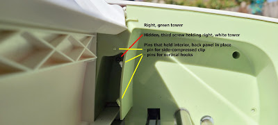 Right green tower with interior back panel removed, exposing pins