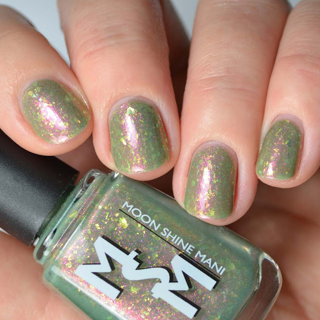 olive green nail polish with flakies swatch