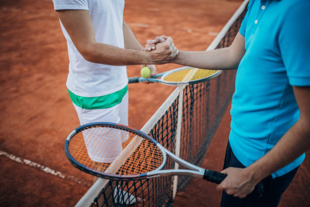 Tennis players shaking hands after a match