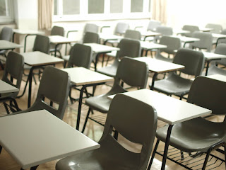 Empty desks and chairs in a classroom