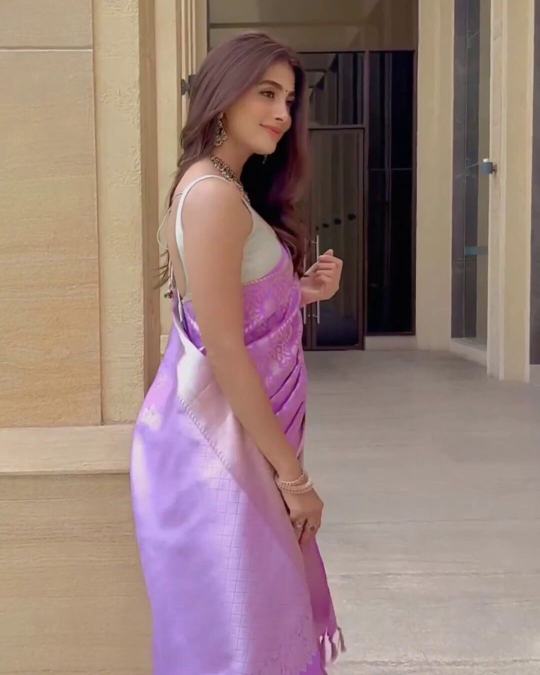 Pooja Hegde looks stunning in Purple Banarasi saree with strappy blouse