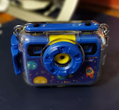 The Camera showing Lens in Water Resistant Case.