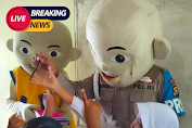 Anggota Polri Rela  Pakai Kostum Badut Dan Memberikan Reward  Demi Kelancaran Kegiatan Vaksinasi Anak