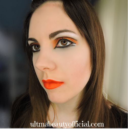 Ultima Beauty wearing Cincinnati Bengals colored makeup, opened eyes