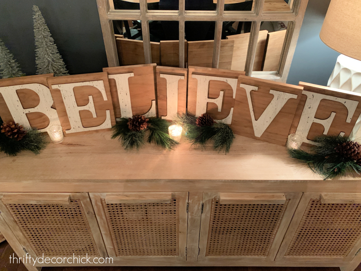 wood BELIEVE lettered sign