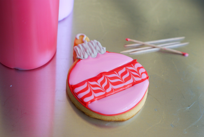 a marbled christmas decorated cookie with toothpicks