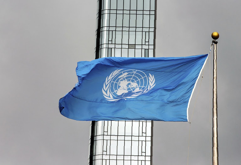 Waving, the UN flag signals Cambodia seeks intervention in its Thai border dispute.