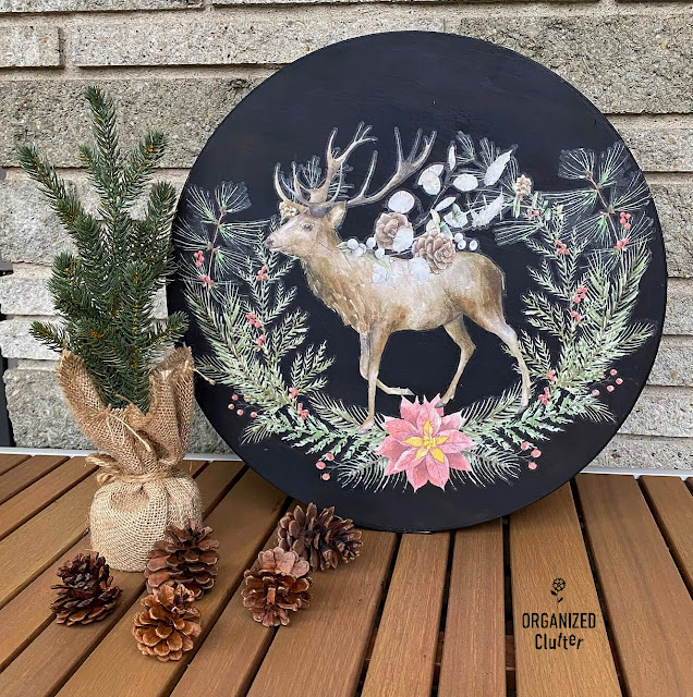 Photo of a Christmas deer transfer applied to the lid of a thrifted & painted wooden box.