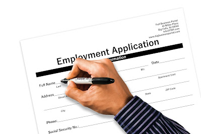 White hand filling out application