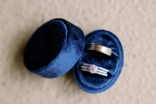 blue ring box with wedding rings