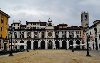 The elegant Piazza della Loggia in Brescia, where the clock tower shows Venetian influence