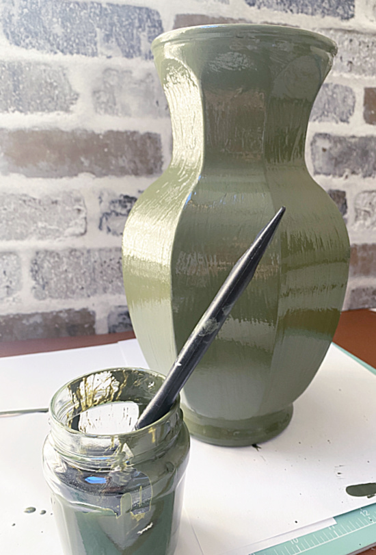 green vase and paint