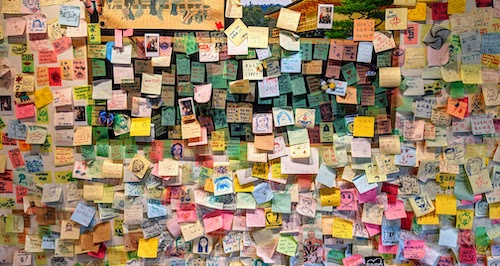 Well wishes on Post-It notes on the wall