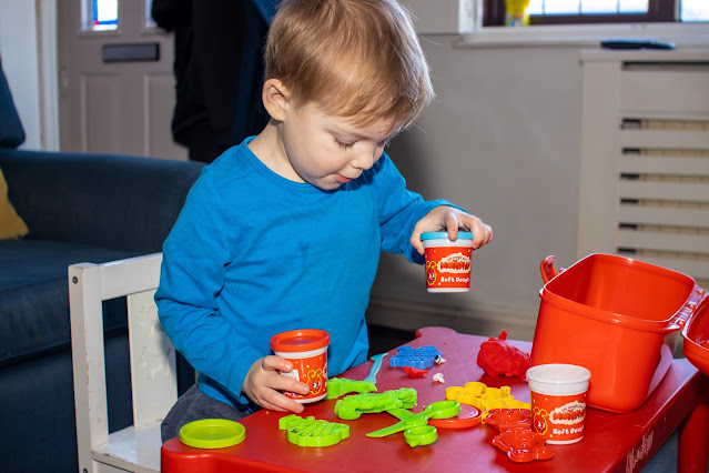 A boy with some Morphle playdoh style toy