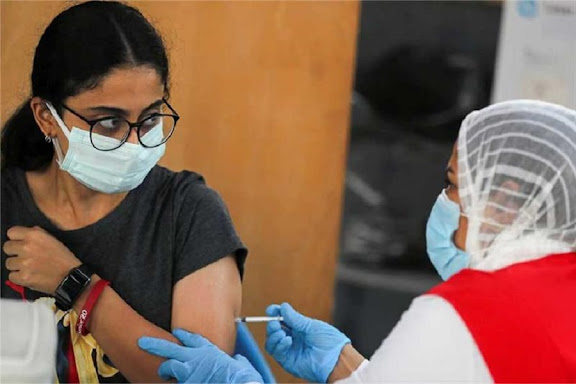 Egyptian woman vaccinated in Egypt "Reuters"